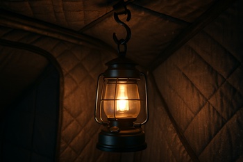 Lantern hanging from a small hook inside an ice shelter