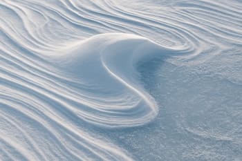 Wind-sculpted snow pocket sitting over rough ice